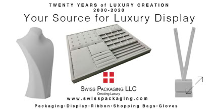 Display of jewelry stands and trays with text promoting luxury display products from Swiss Package LLC.