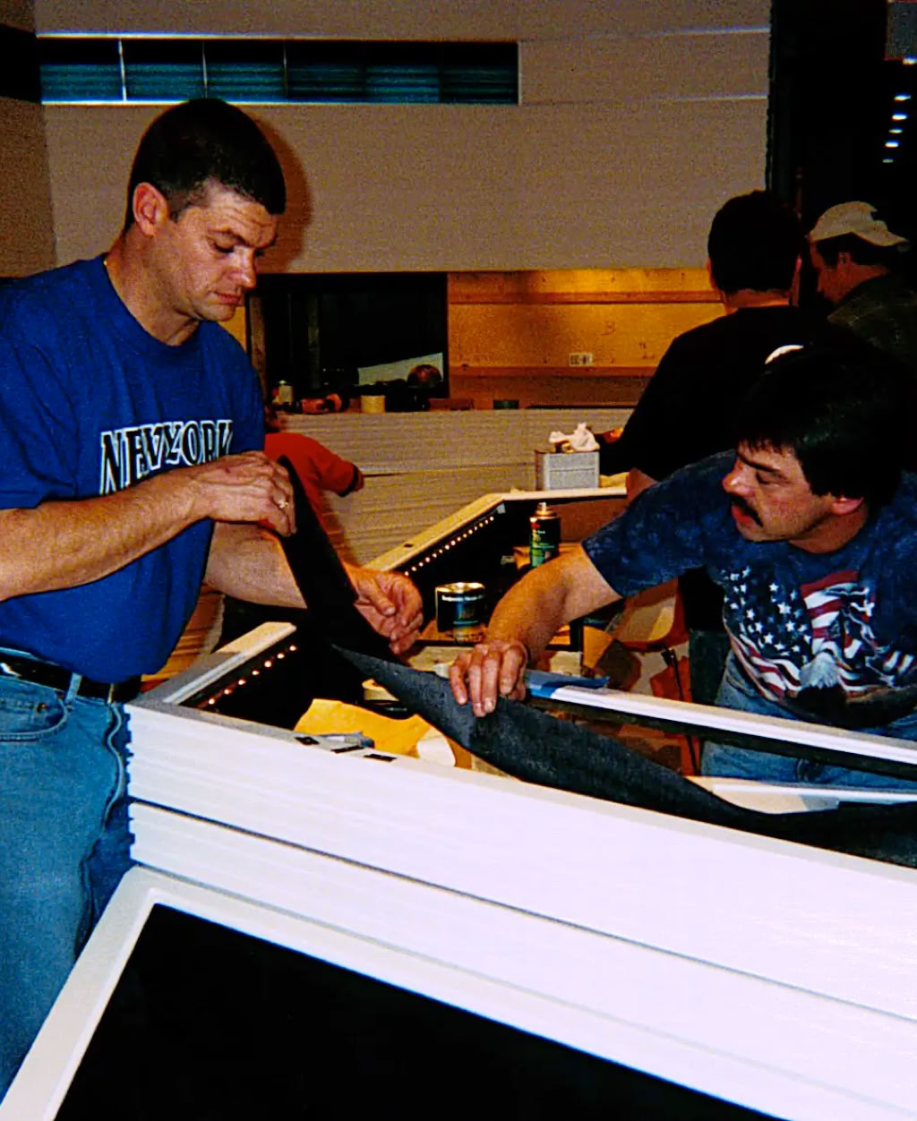 Swiss Packaging museum installation team executing precision installation of display systems, ensuring alignment, detailing, and presentation at the highest level.