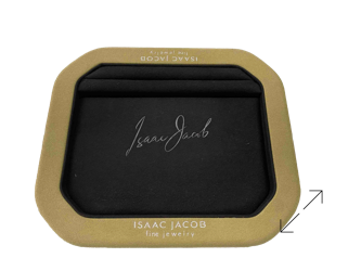 A black rectangular cut pan tray with rounded corners, featuring a microfiber frame and a signature in the center; design and manufacturing by Swiss Packaging of New York and Switzerland