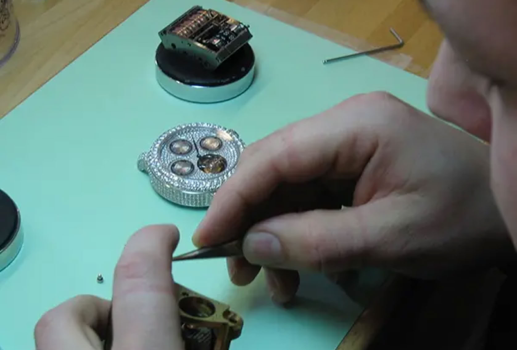 Assembly of watch components, demonstrating precision craftsmanship and the transition from design to physical product.