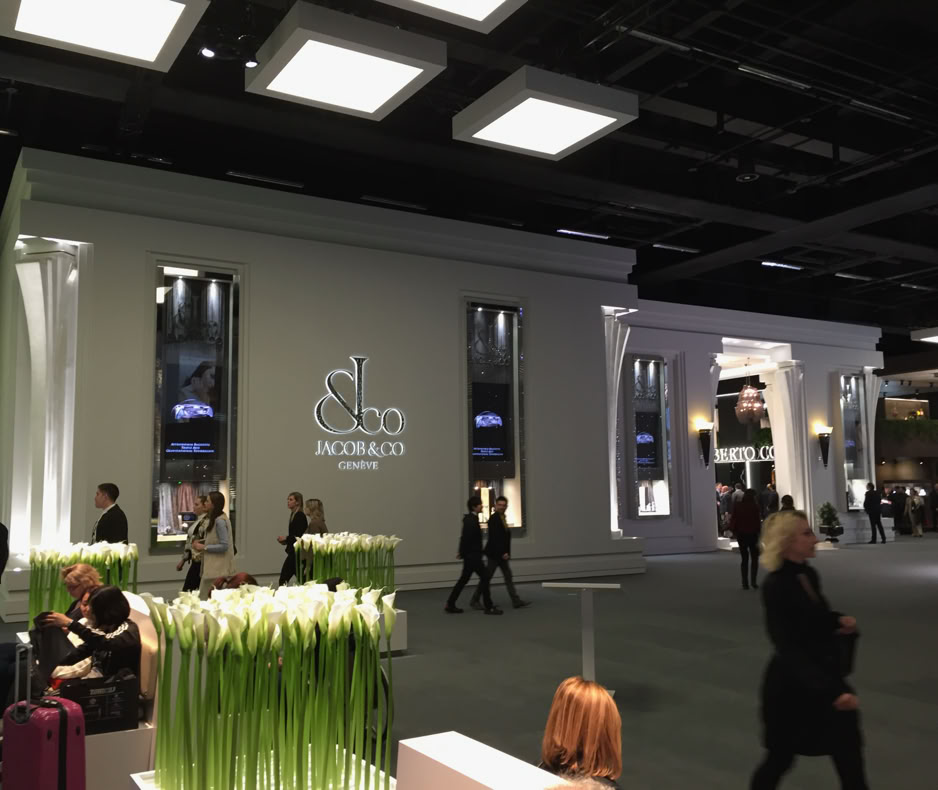 Client engagement area within Jacob & Co Baselworld exhibition stand designed by Swiss Packaging for high-end watch presentation
