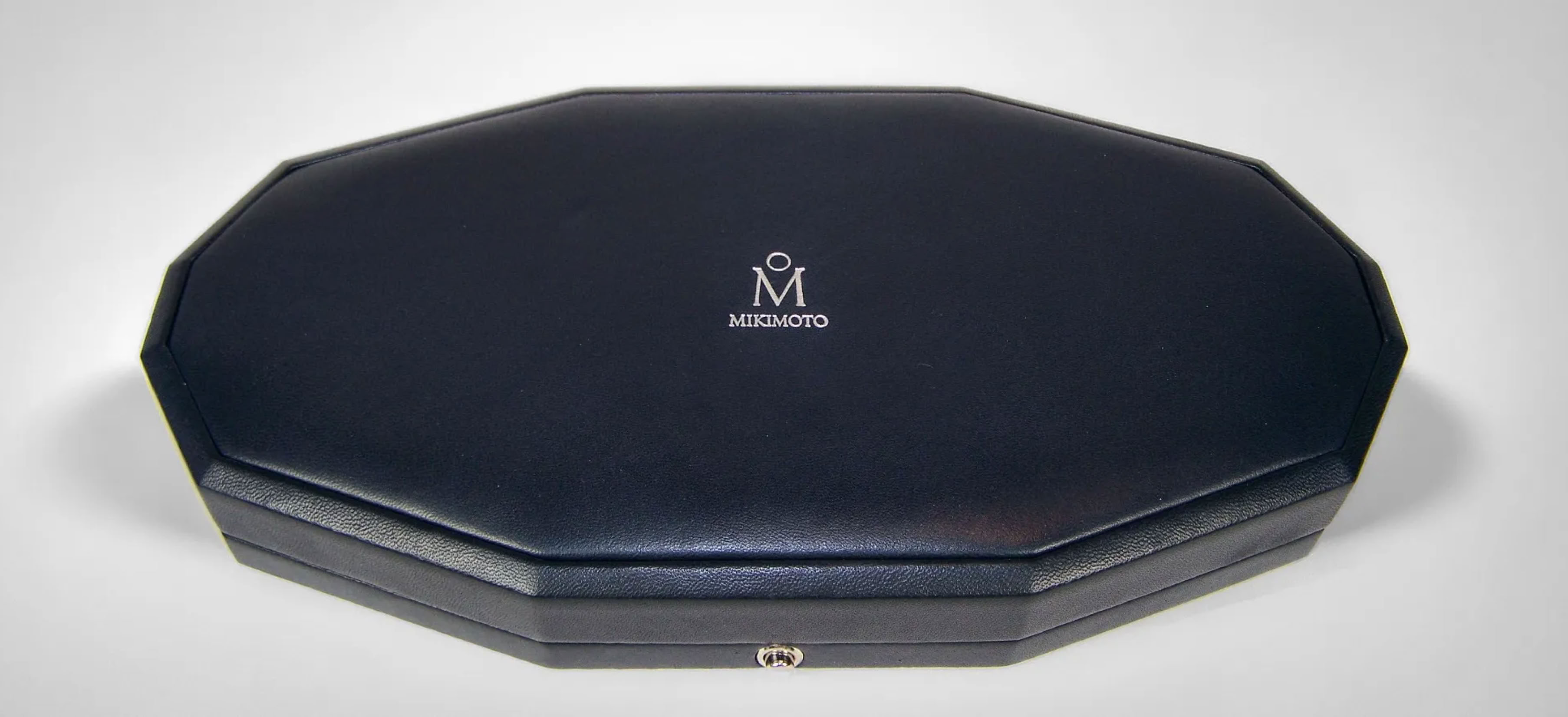 Luxury jewelry packaging box with blue nappa leather for Mikimoto VIP presentation and global brand positioning