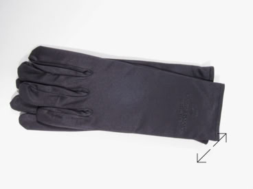 A pair of black jewelers gloves lying flat on a white surface manufactured by Swiss Packaging of New York and Switzerland