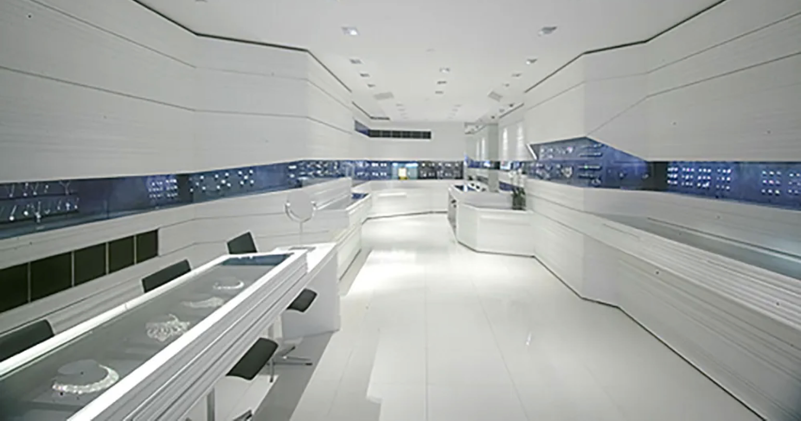 Luxury retail environment for Jacob & Co flagship boutique featuring integrated watch display systems and lighting, translated into the Baselworld exhibition architecture